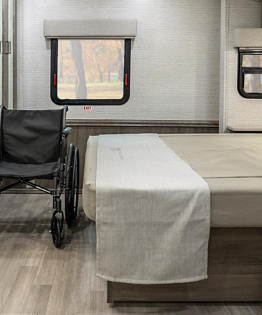 interior of wheelchair accessible motorhome, queen bed